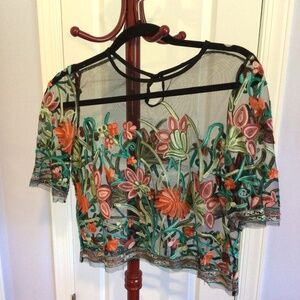 Sheer black crop with floral design. Womens small.